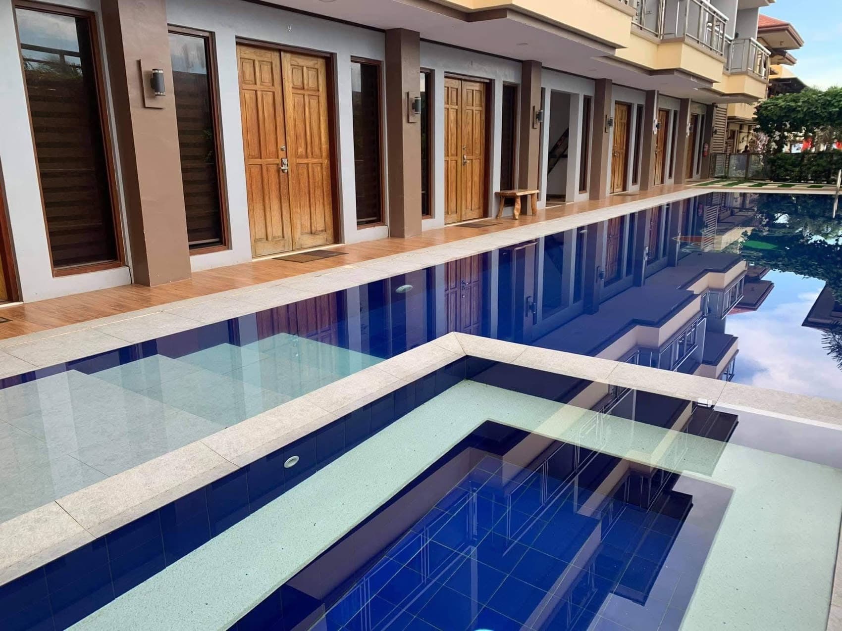 The courtyard lap pool in clear daylight at Cherish Resort, Masbate City